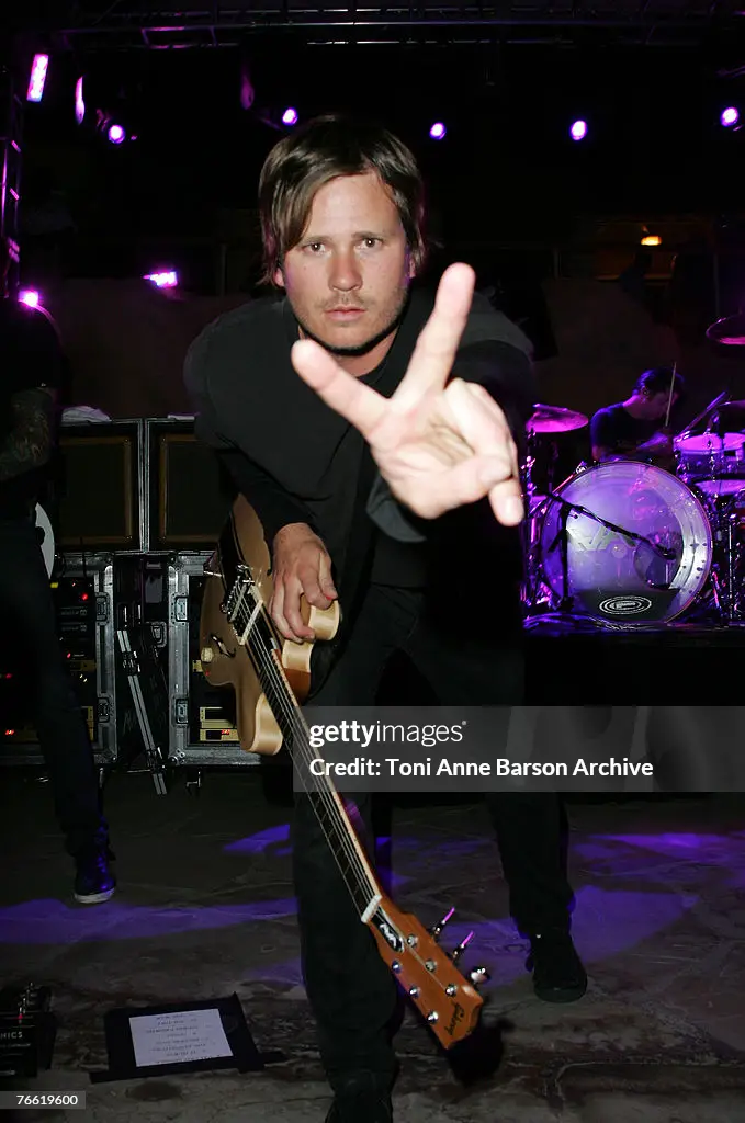 Tom giving a peace sign to the camera