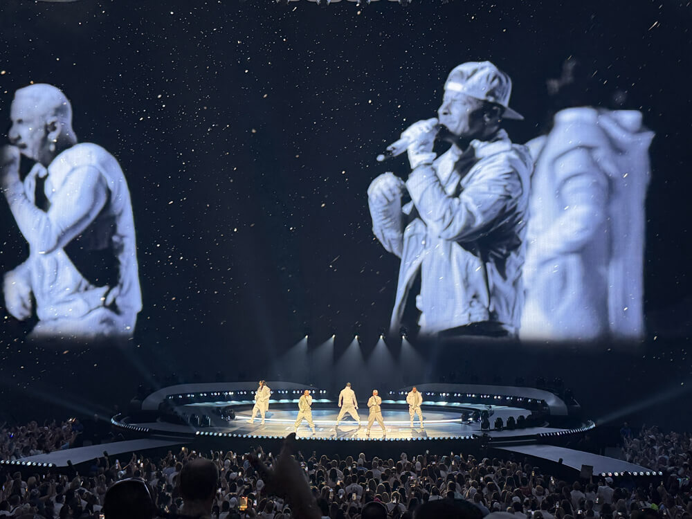 Backstreet Boys on stage with closeup video huge on the Sphere screen