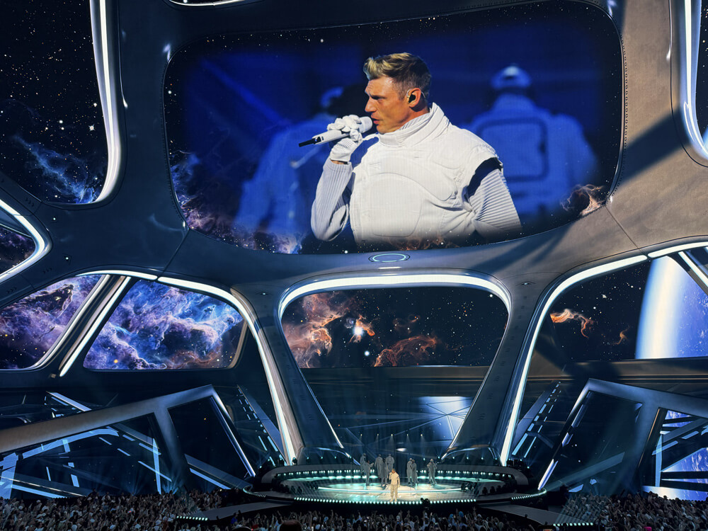 Backstreet Boys on stage, huge closeup of Nick Carter on screen