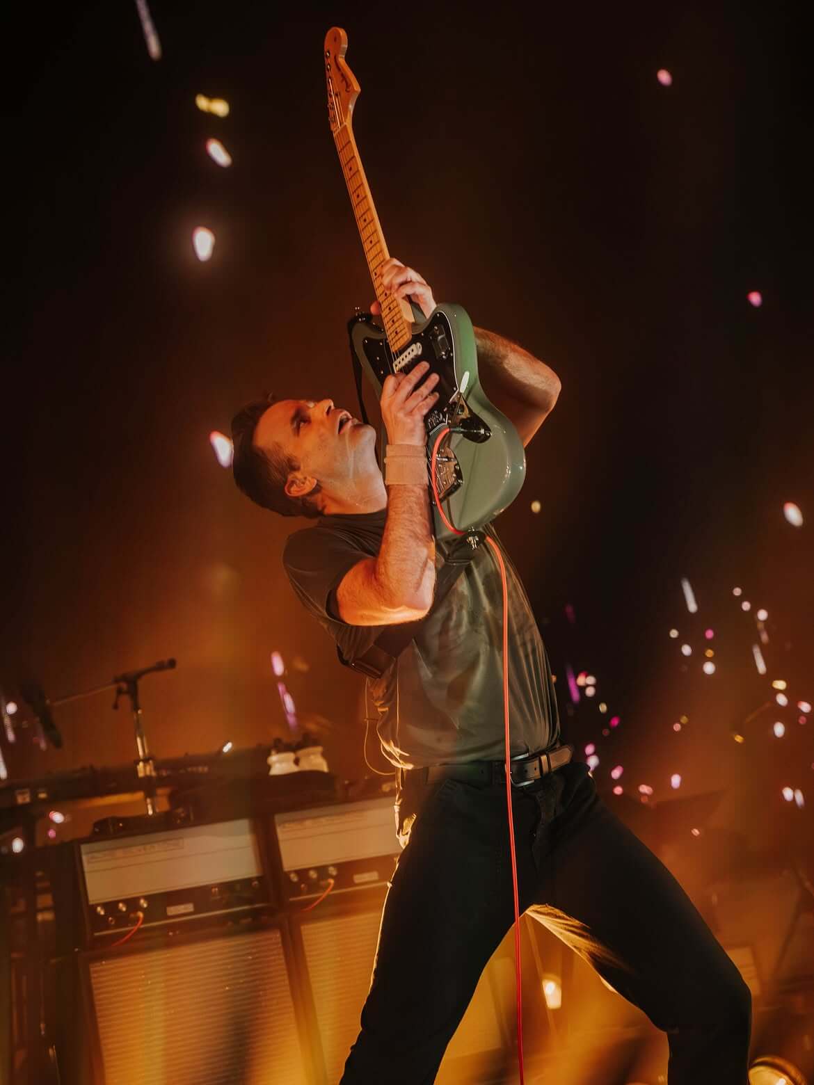 Ben Gibbard holding up his guitar