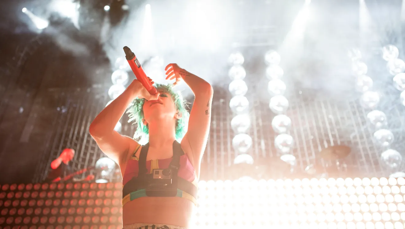 Hayley in front of a big wall of lights