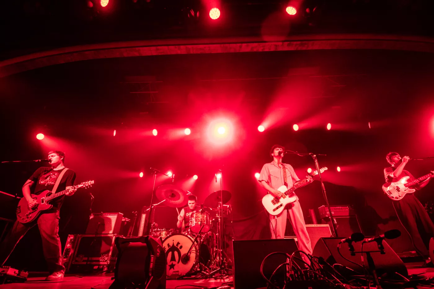 the band Friko bathed in red light