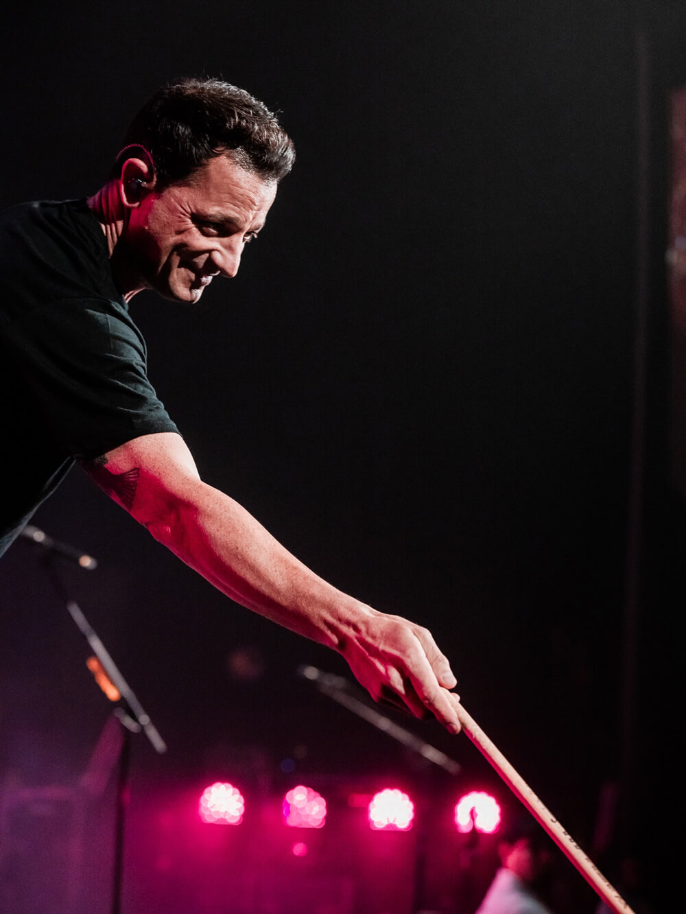 Marc Roberge handing a drumstick to the crowd