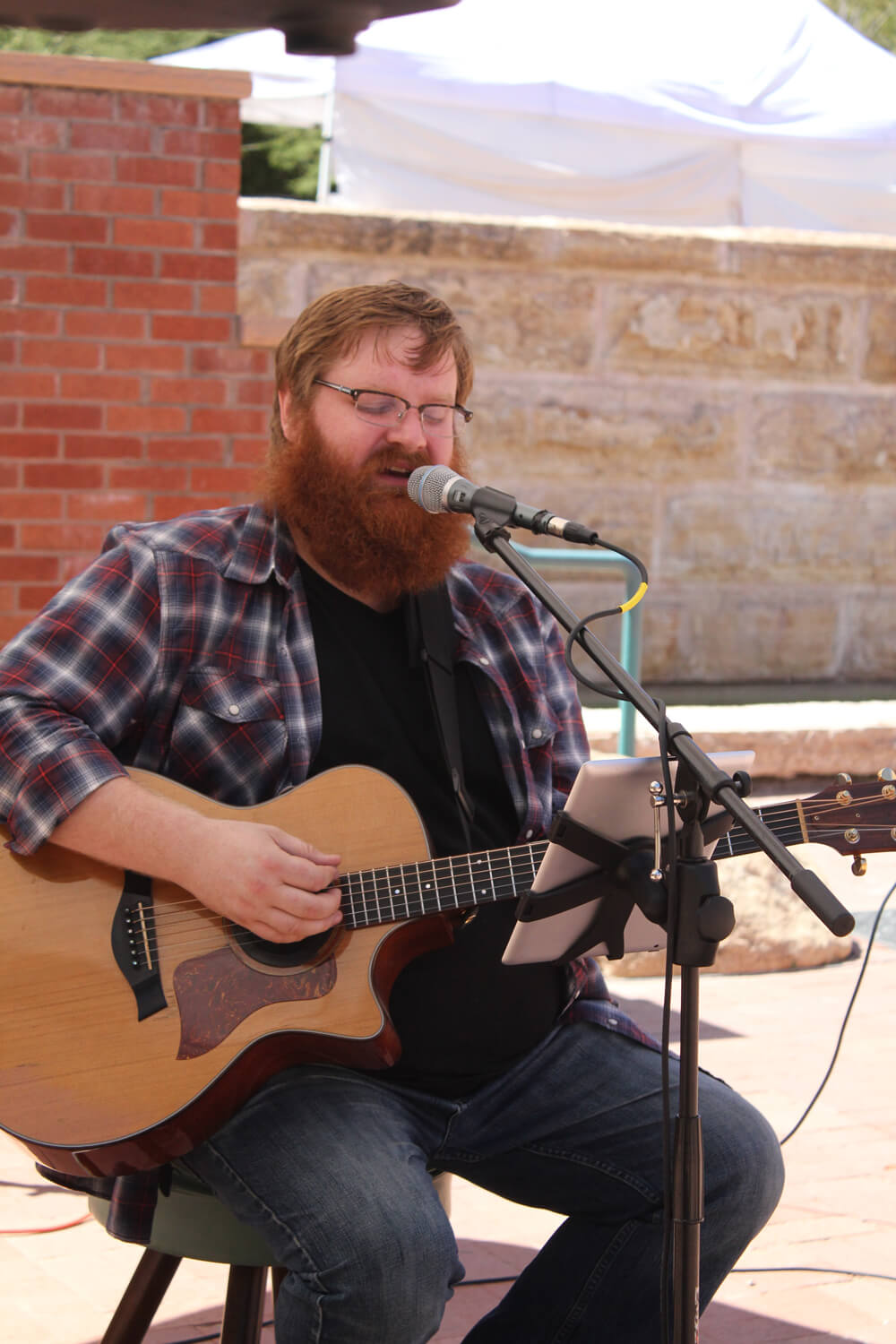 Obadiah Parker playing guitar outdoors