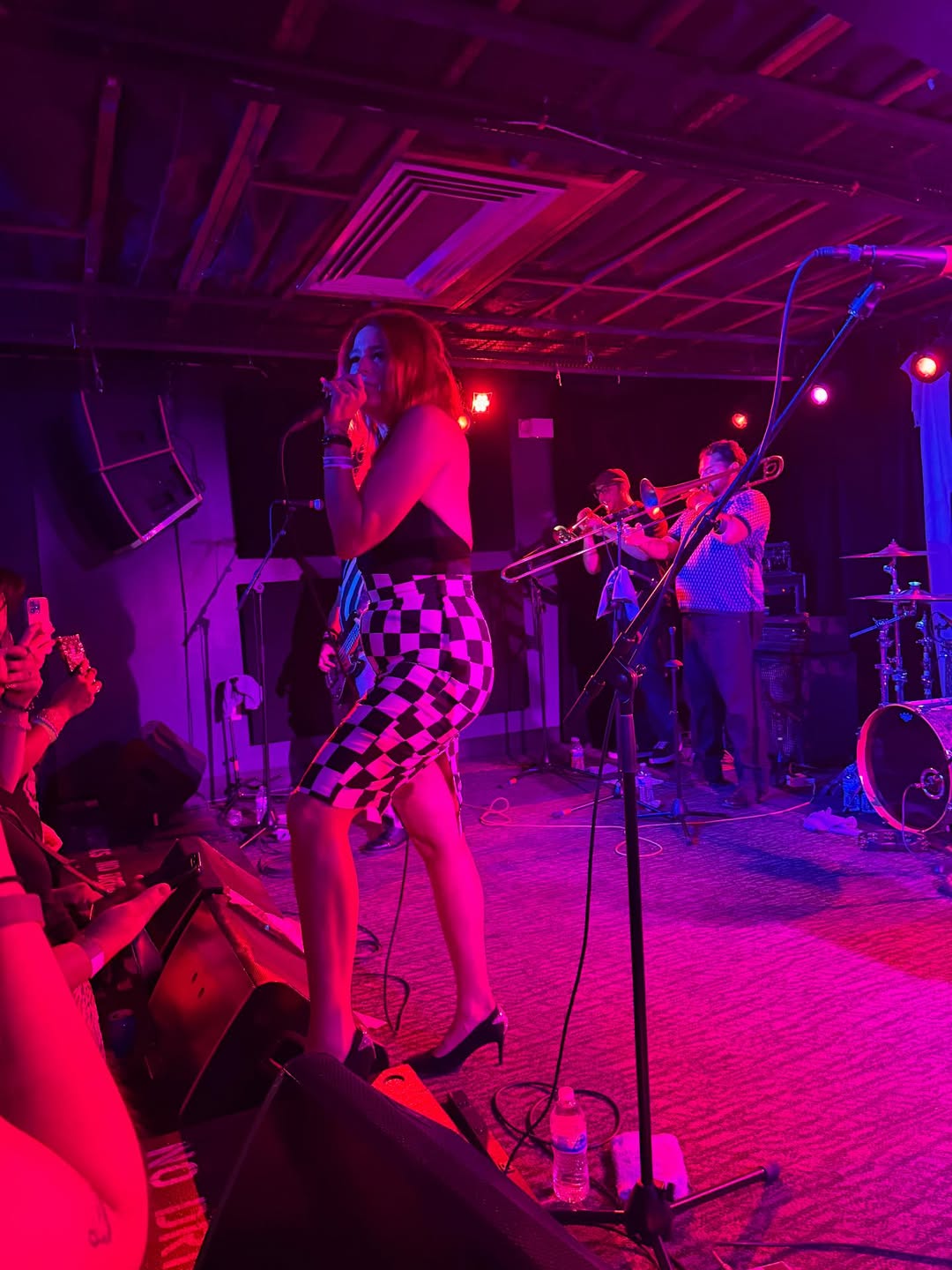 Monique with the horn section behind