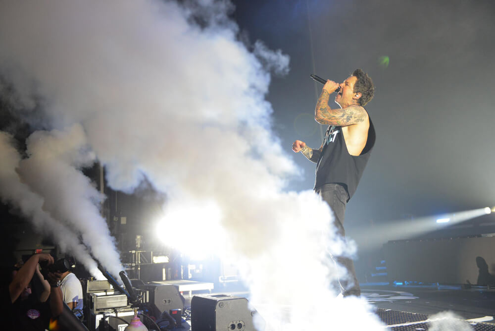 Pierre Bouvier from Simple Plan as fog fills the stadium
