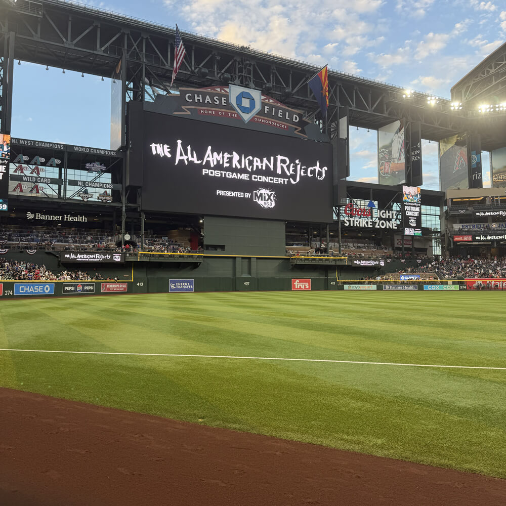 shot from field level of the huge Chase Field display board with The All-American Rejects logo