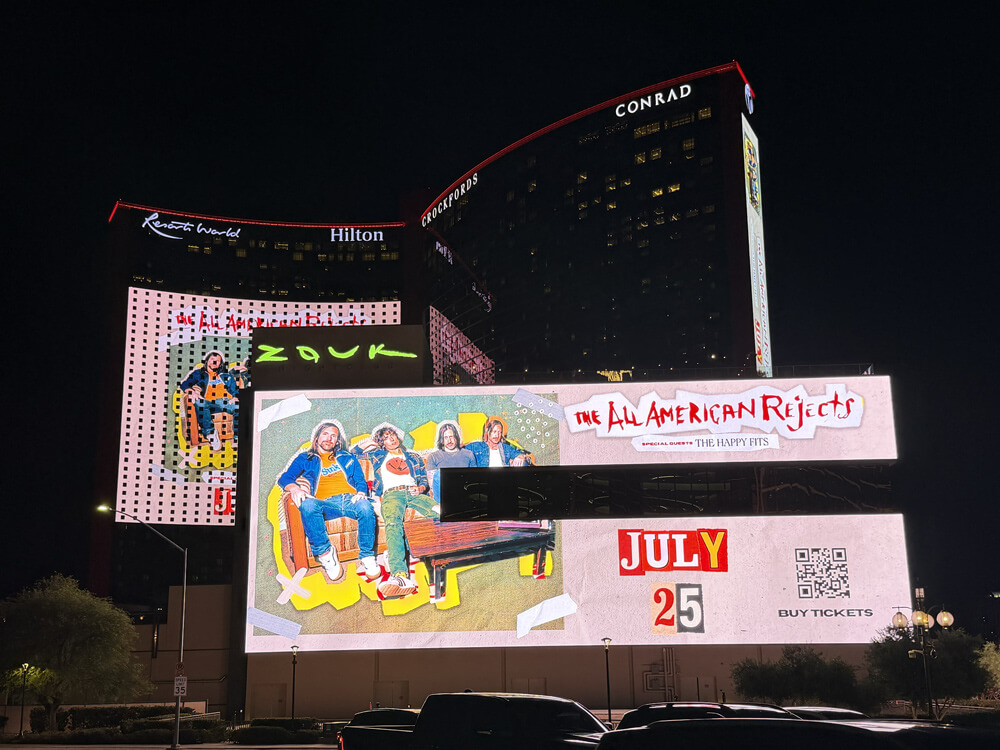 outside of Resorts World hotel with The All-American Rejects huge on a billboard and side of the building