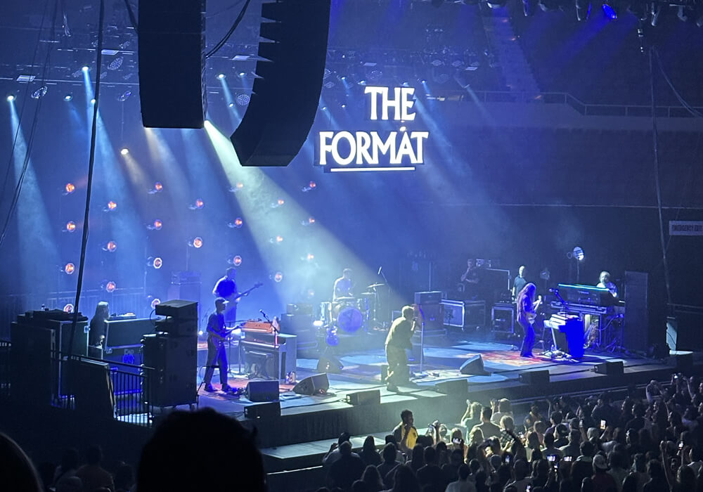 view of the stage from upper left, Nate in a spotlight
