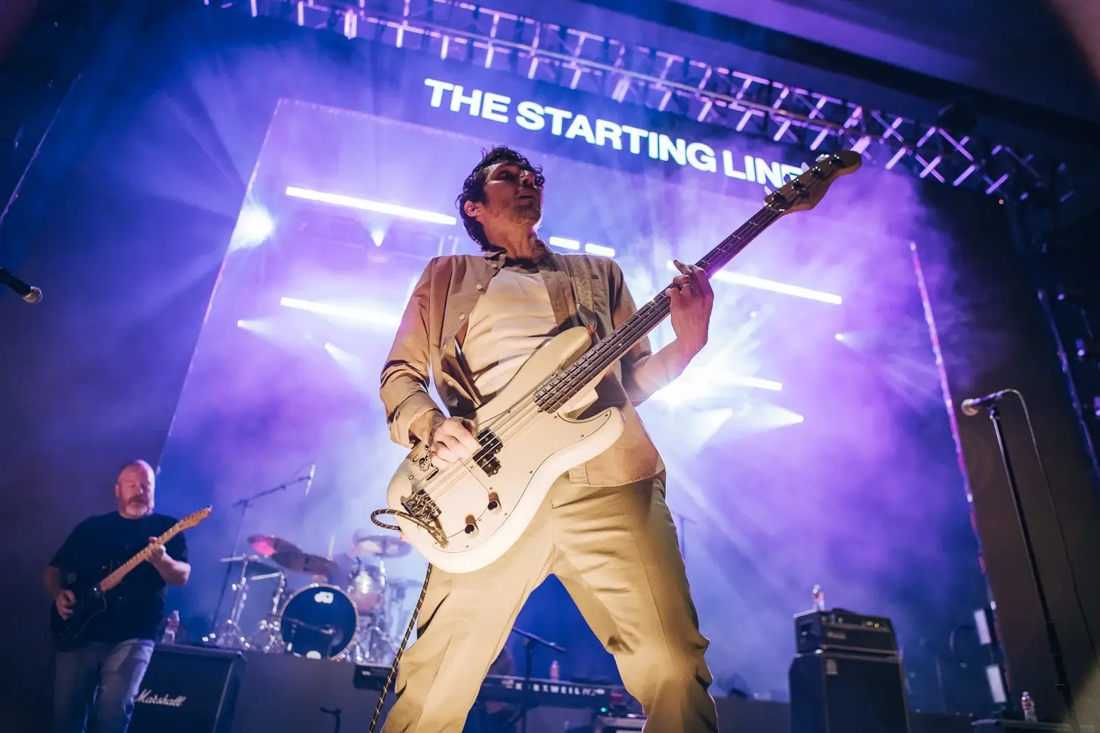 Kenny Vasoli from below framed by light beams