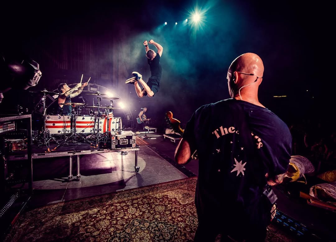 Chuck flying high as he jumps off the drum platform