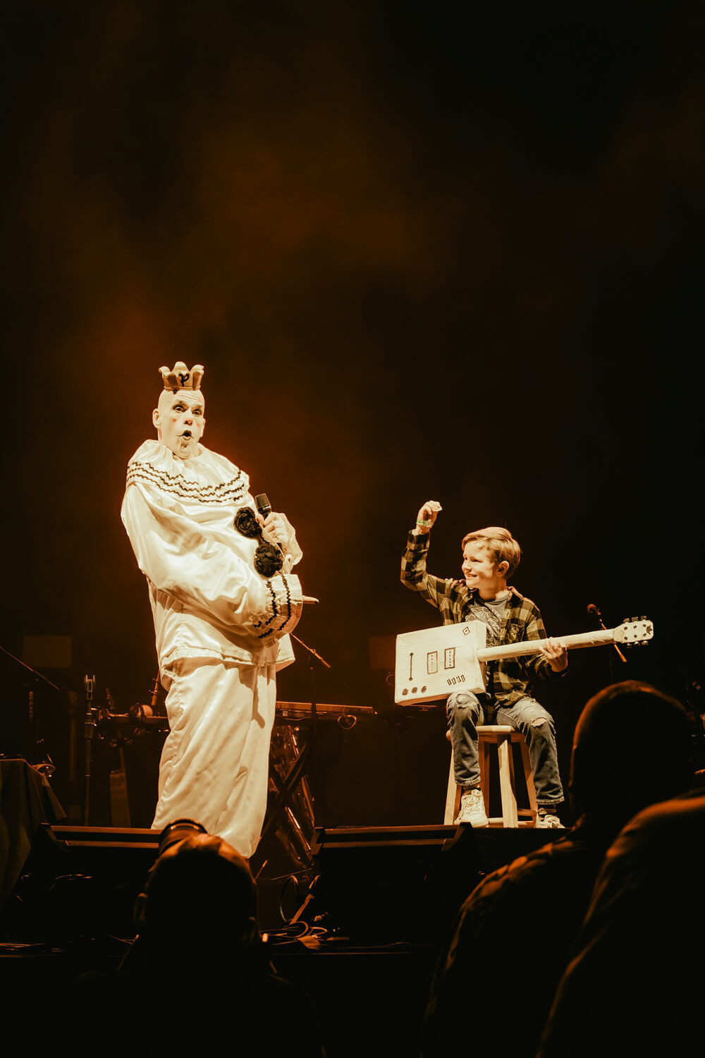 Puddles Pity Party with a young boy playing a cardboard guitar